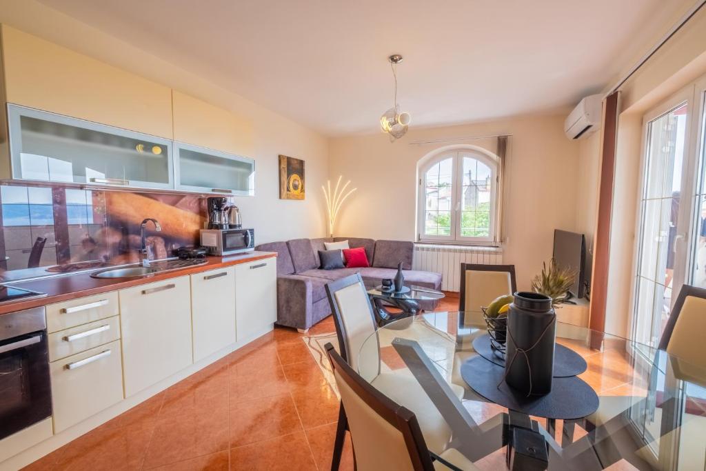 Kuchyň nebo kuchyňský kout v ubytování Apartments Laganini