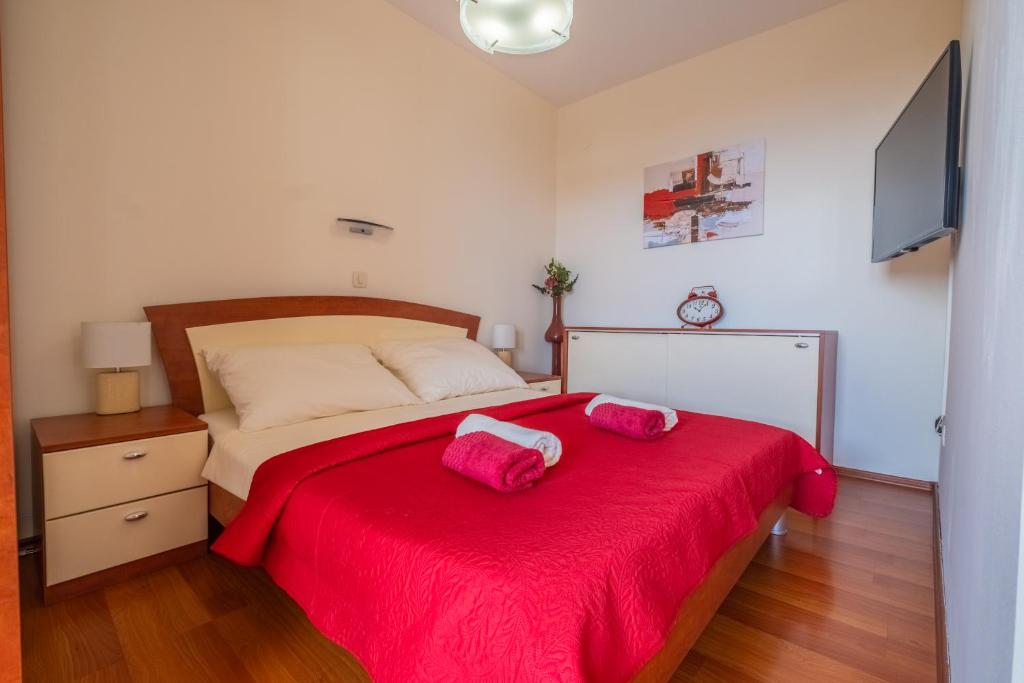 Postel nebo postele na pokoji v ubytování Apartments Laganini