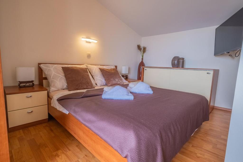 Postel nebo postele na pokoji v ubytování Apartments Laganini