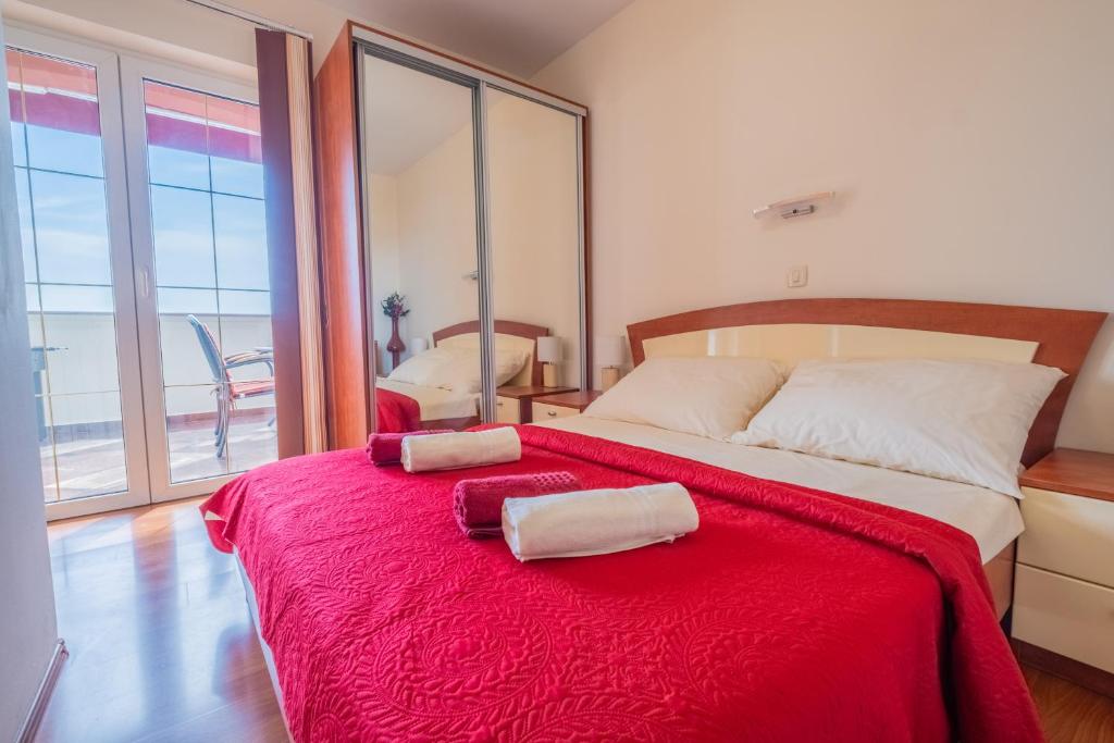 Postel nebo postele na pokoji v ubytování Apartments Laganini