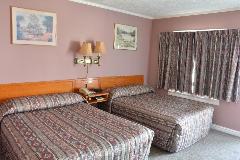 Postel nebo postele na pokoji v ubytování Bracebridge Inn