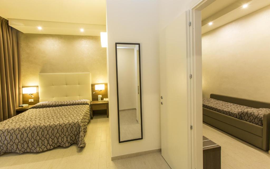 Postel nebo postele na pokoji v ubytování Hotel Touring