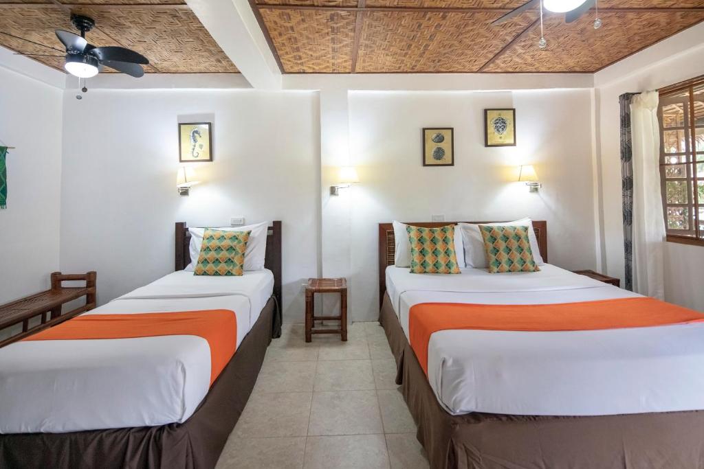 Postel nebo postele na pokoji v ubytování Oasis Resort