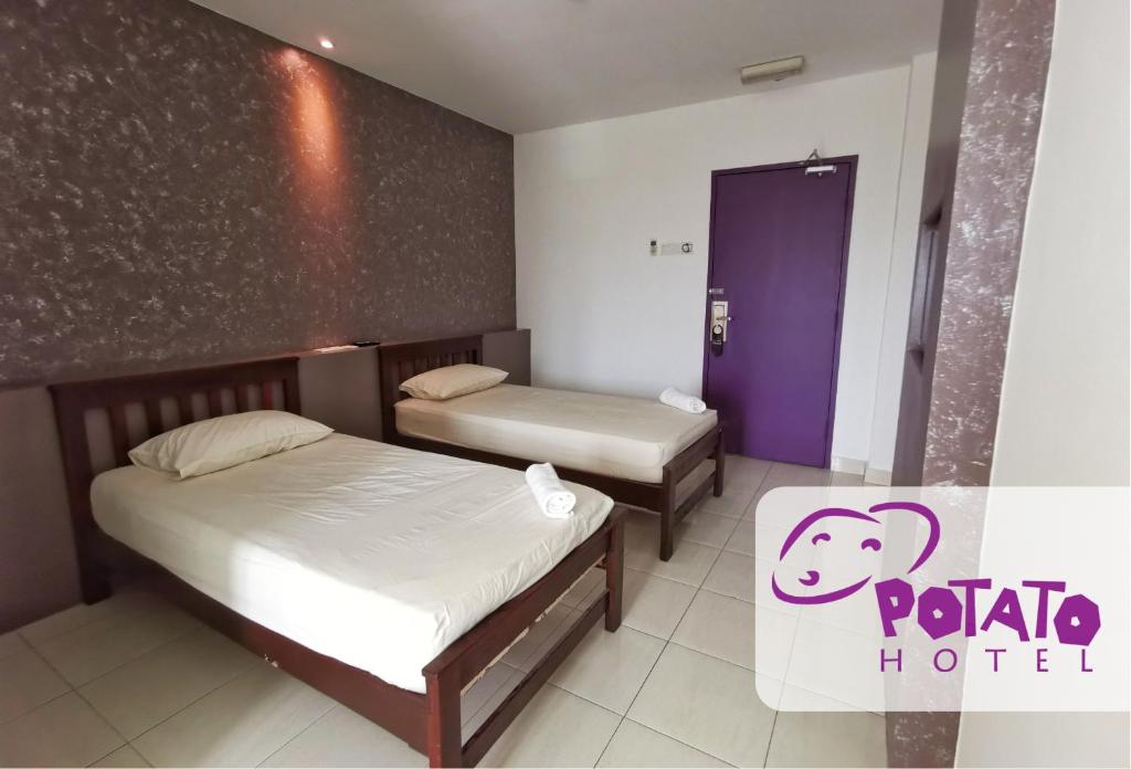 Postel nebo postele na pokoji v ubytování Potato Hotel