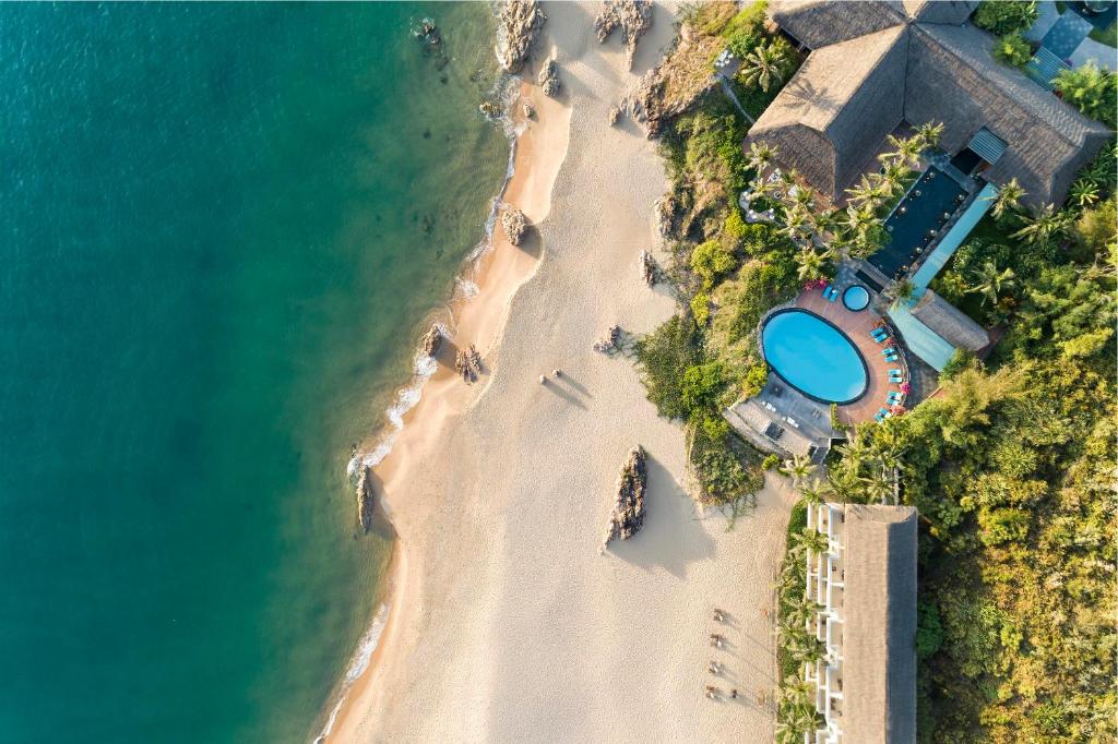 an aerial view of a beach with a resort at Avani Quy Nhon Resort in Quy Nhon