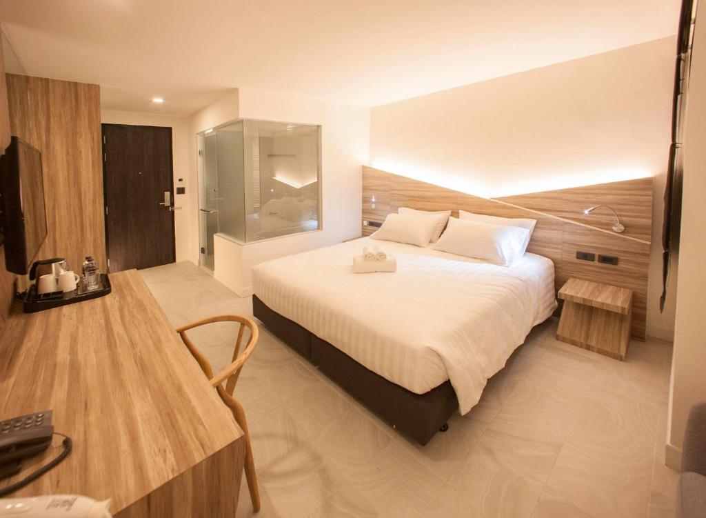 Postel nebo postele na pokoji v ubytování WE Terminal Hotel