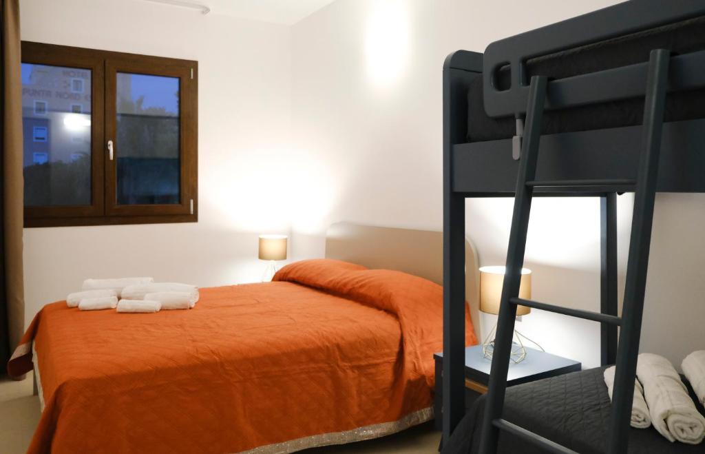 Postel nebo postele na pokoji v ubytování SOL Y MAR Camere e Appartamenti