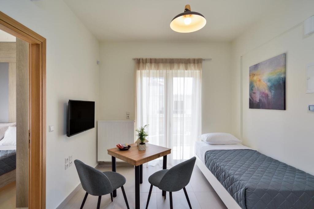 Telewizja i/lub zestaw kina domowego w obiekcie Elia Residences