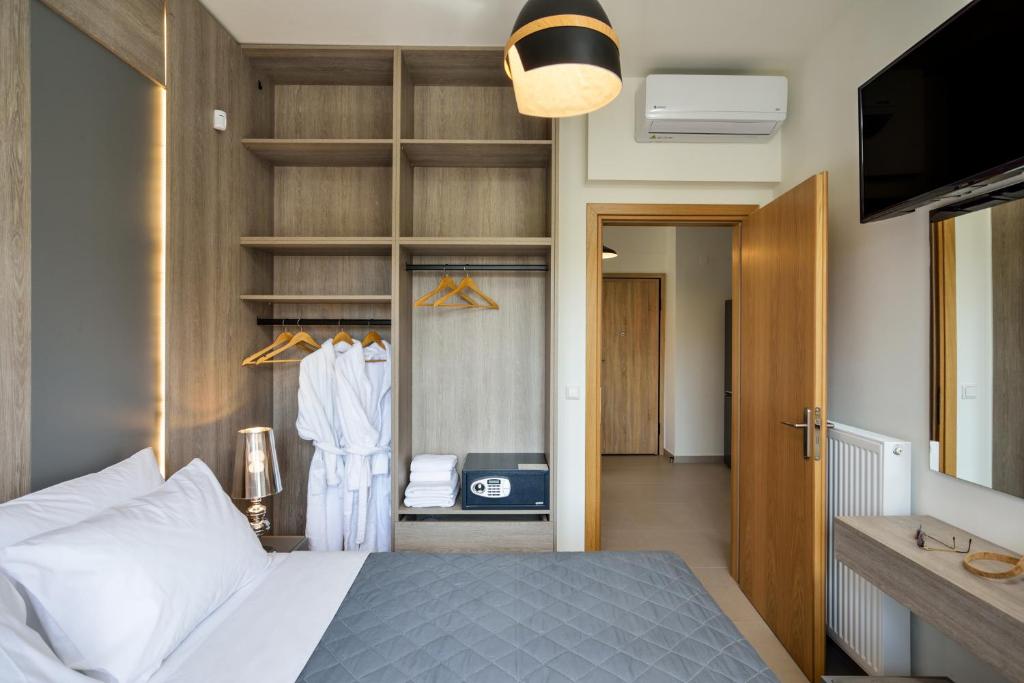 Łóżko lub łóżka w pokoju w obiekcie Elia Residences