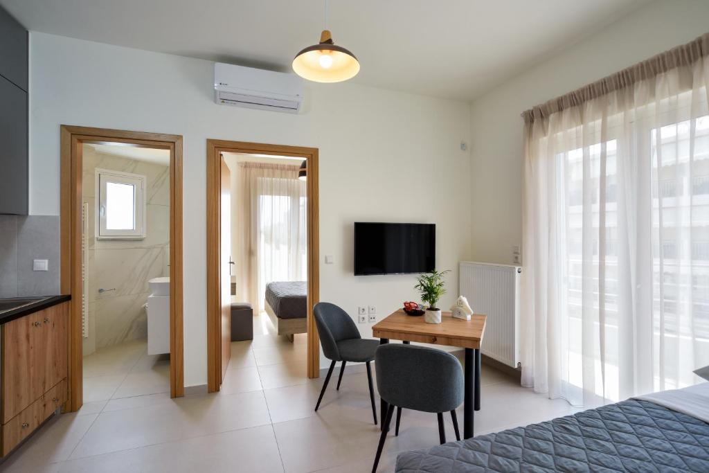 Telewizja i/lub zestaw kina domowego w obiekcie Elia Residences