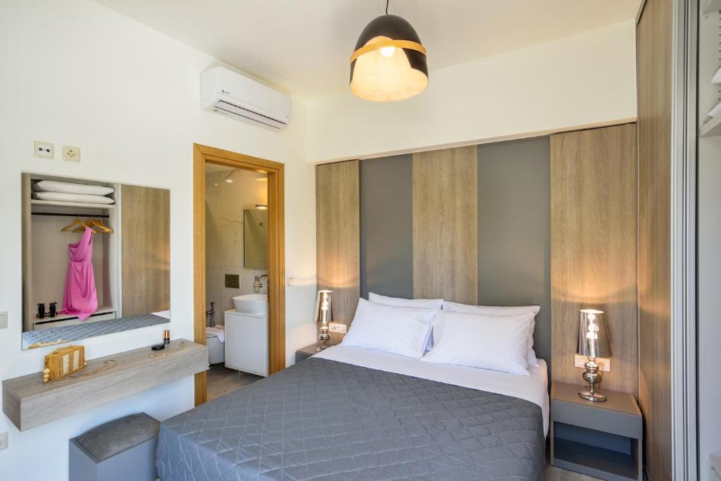Łóżko lub łóżka w pokoju w obiekcie Elia Residences