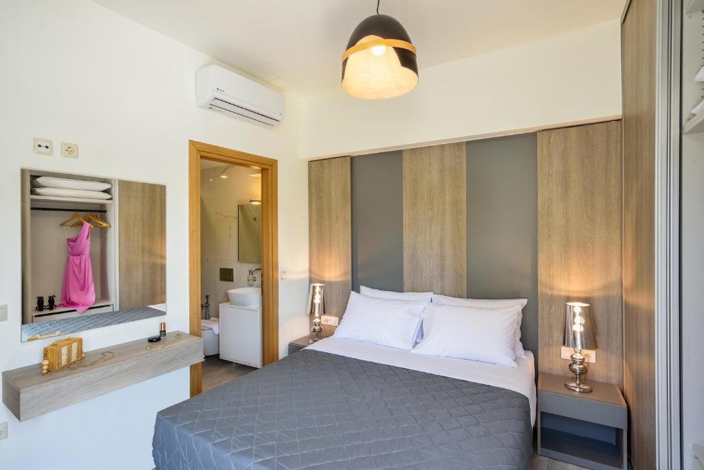 Łóżko lub łóżka w pokoju w obiekcie Elia Residences