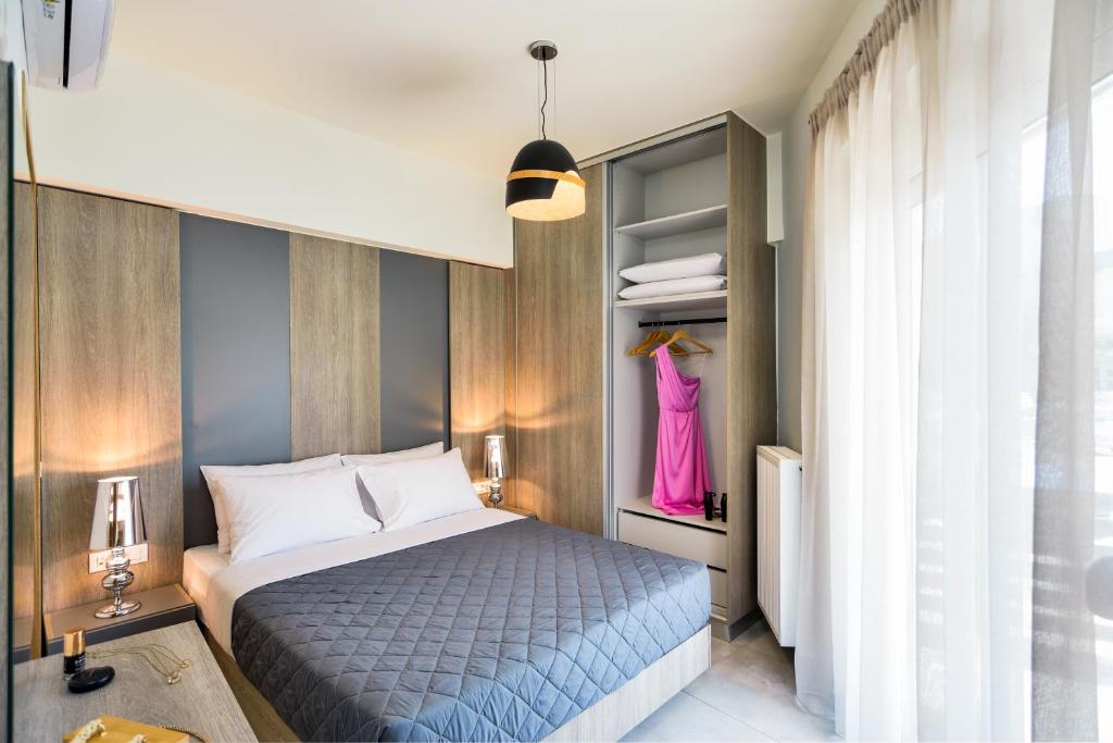 Łóżko lub łóżka w pokoju w obiekcie Elia Residences