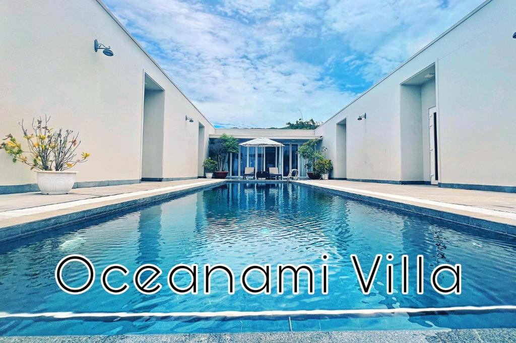 a swimming pool in the backyard of a house at Oceanami 5 Bedrooms Private Pool in Long Hai