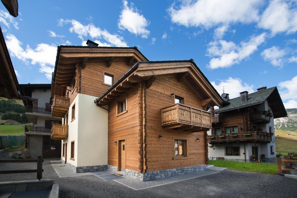 a large wooden building with balconies on it at Central Rin in Livigno