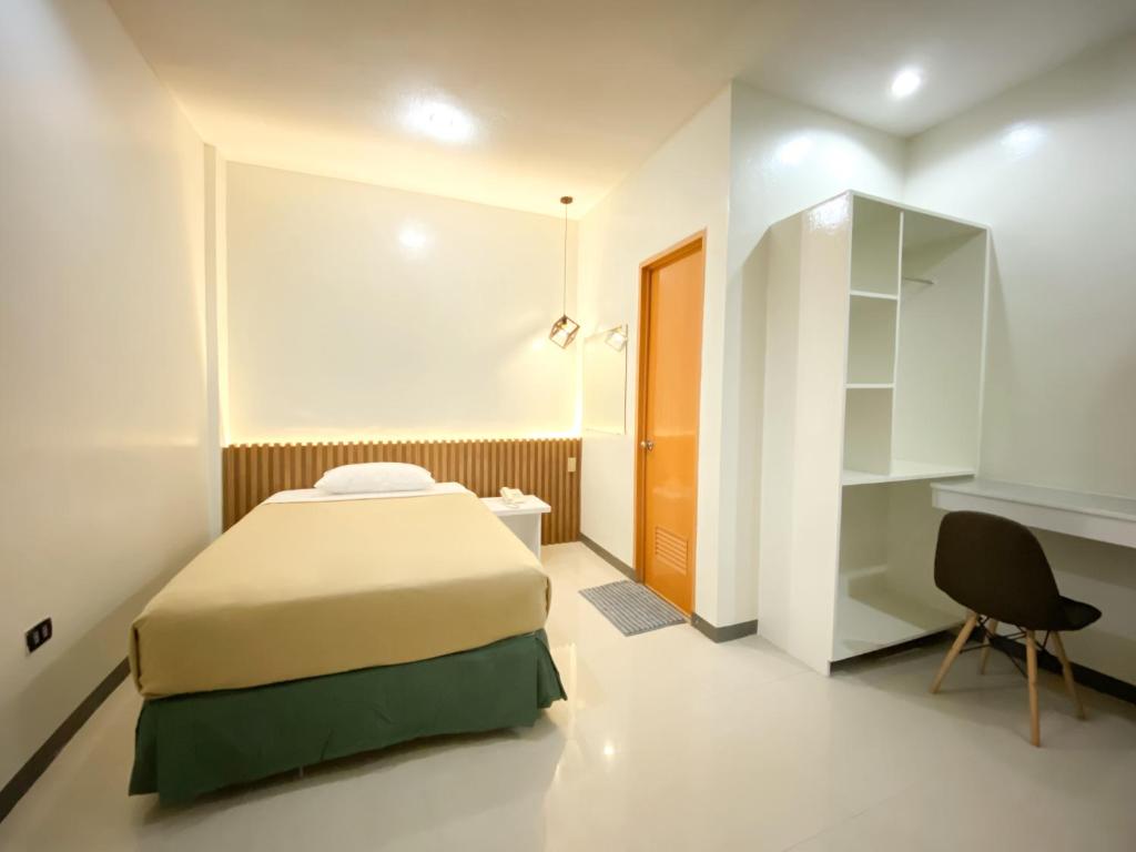 Postel nebo postele na pokoji v ubytování Ariano's Inn