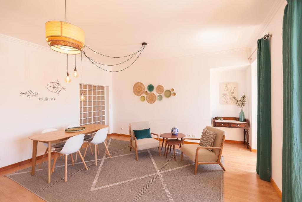 a dining room with a table and chairs at FLH Alfama Flat with River View in Lisbon