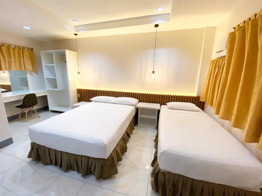 Postel nebo postele na pokoji v ubytování Ariano's Inn