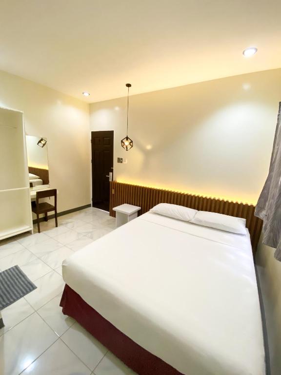 Postel nebo postele na pokoji v ubytování Ariano's Inn