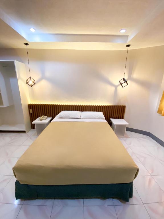 Postel nebo postele na pokoji v ubytování Ariano's Inn