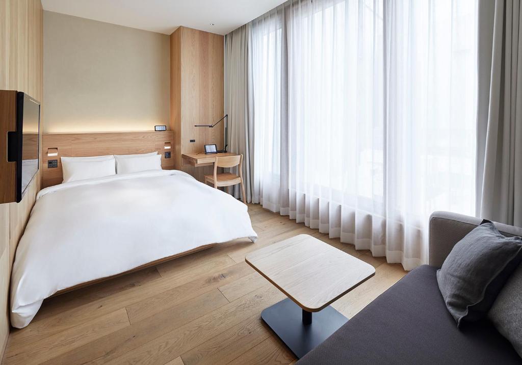 Postel nebo postele na pokoji v ubytování MUJI HOTEL GINZA