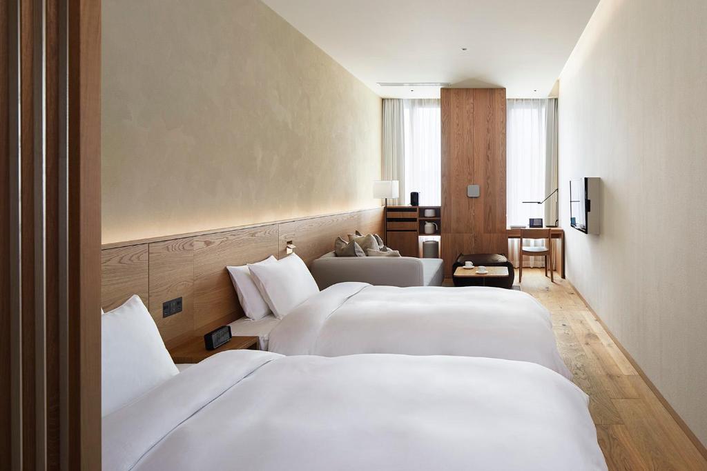 Postel nebo postele na pokoji v ubytování MUJI HOTEL GINZA