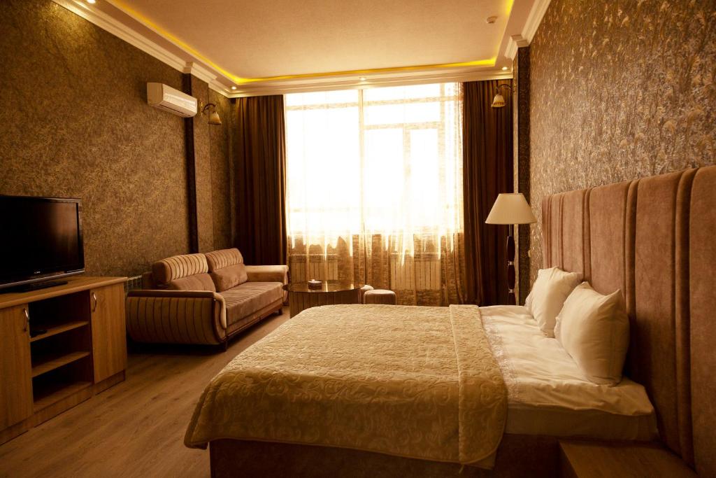 Postel nebo postele na pokoji v ubytování Hotel Felisa Gyumri
