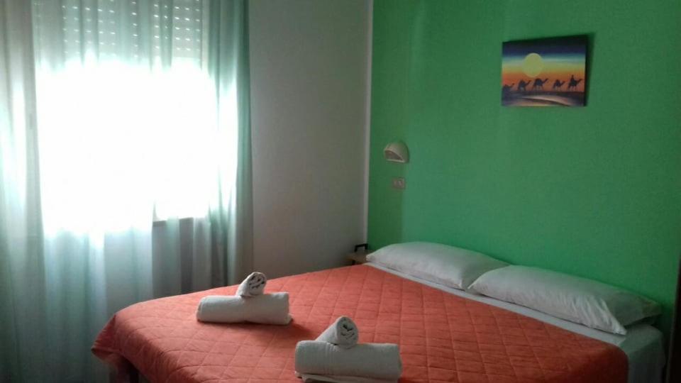 Postel nebo postele na pokoji v ubytování Hotel Acapulco sul mare