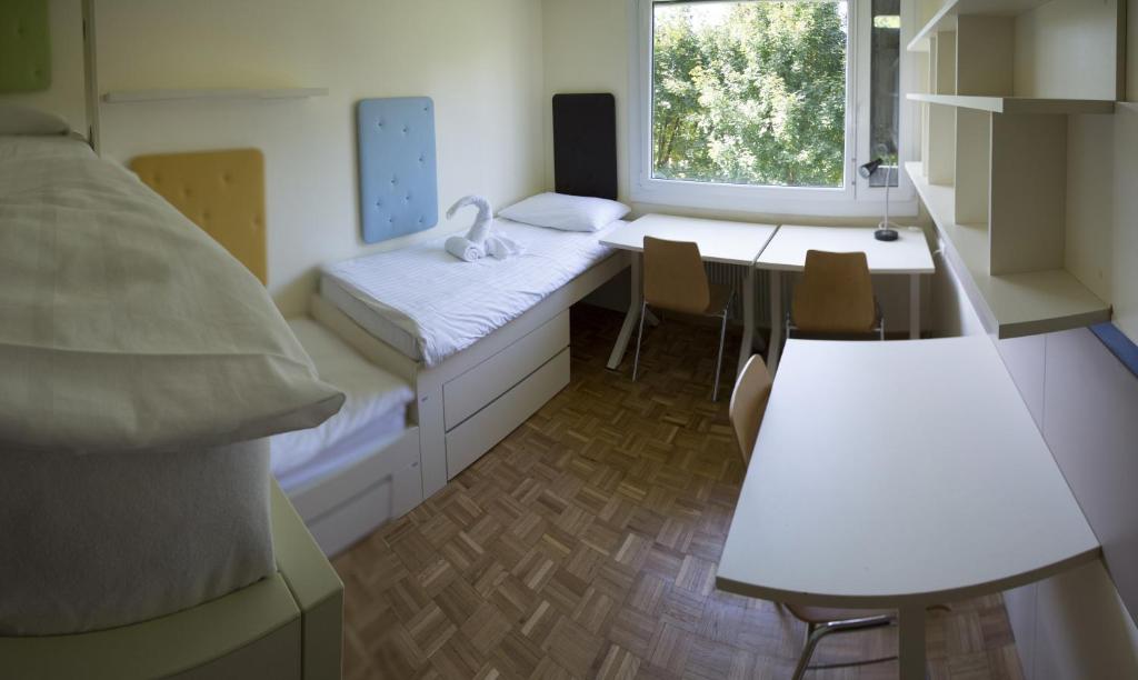 Postel nebo postele na pokoji v ubytování Hostel DIC