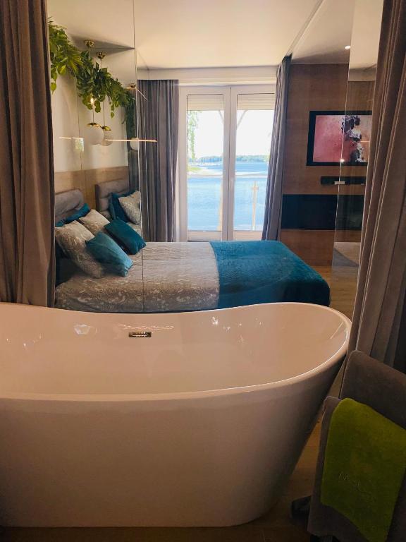 Posteľ alebo postele v izbe v ubytovaní Apartament MoLoo III