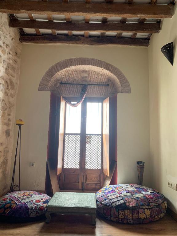 Postel nebo postele na pokoji v ubytování La Casita de la Muralla