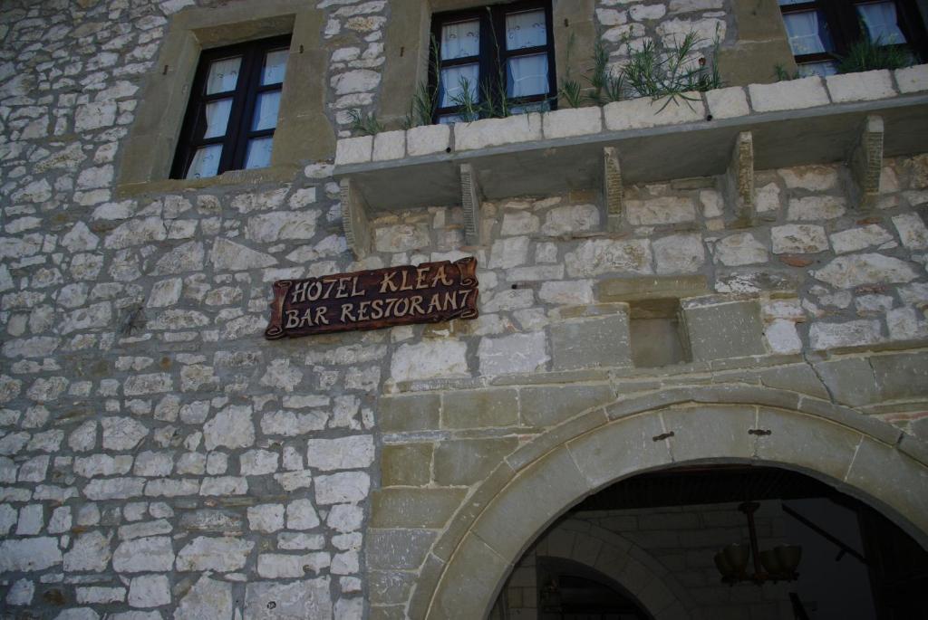 a sign on the side of a stone building at Hotel Klea in Berat
