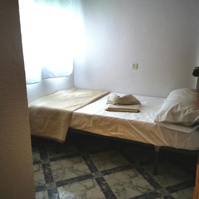 Posteľ alebo postele v izbe v ubytovaní PISO CENTRICO EN PUNTA UMBRIA