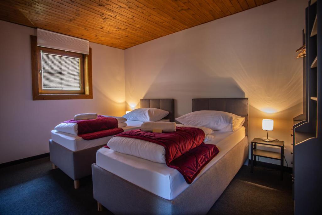Postel nebo postele na pokoji v ubytování Resort Drevenice Terchova