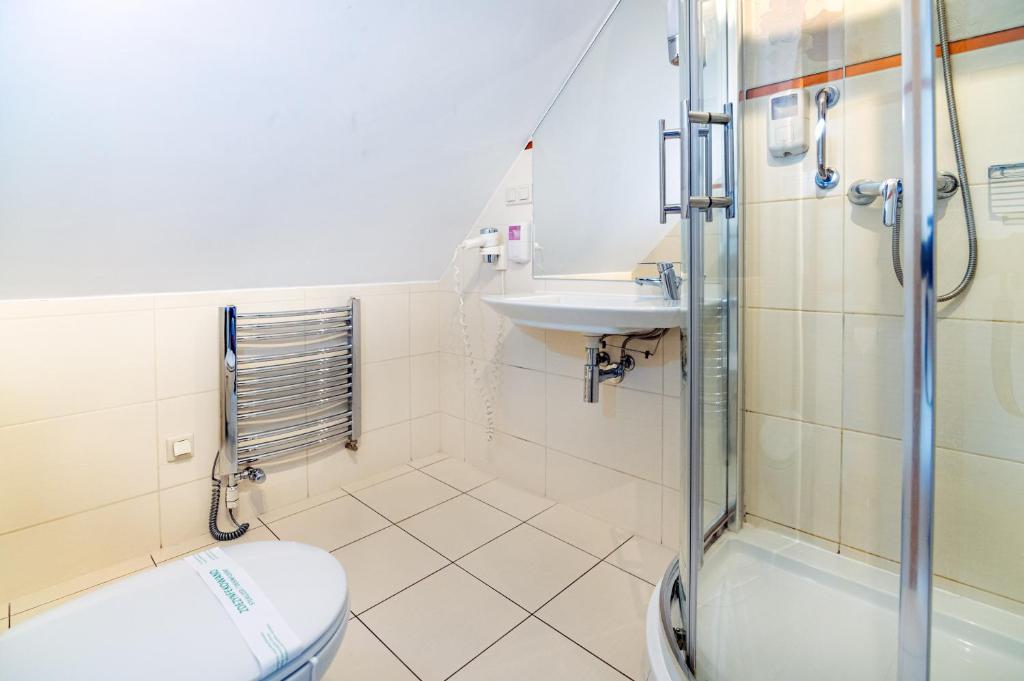 Koupelna v ubytování Hotel Pod Filarami