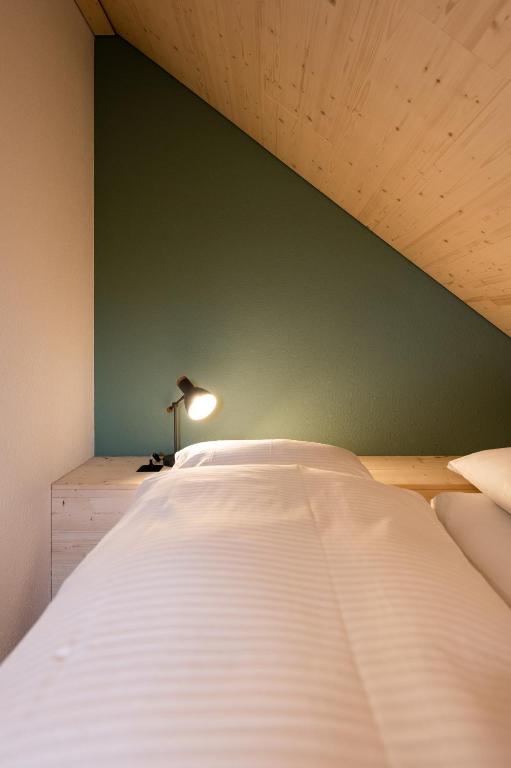Postel nebo postele na pokoji v ubytování Lindenhof Ebnet
