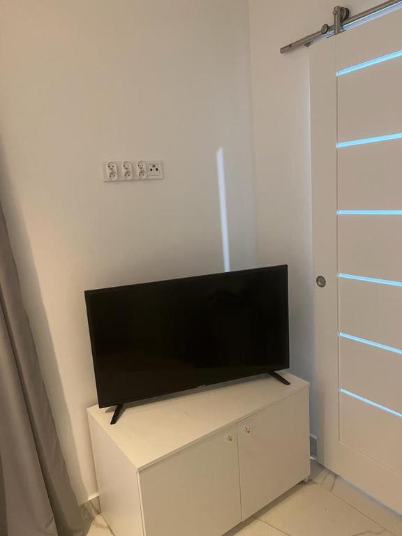 Televízia a/alebo spoločenská miestnosť v ubytovaní Apartamenty u Ewy - EUROS