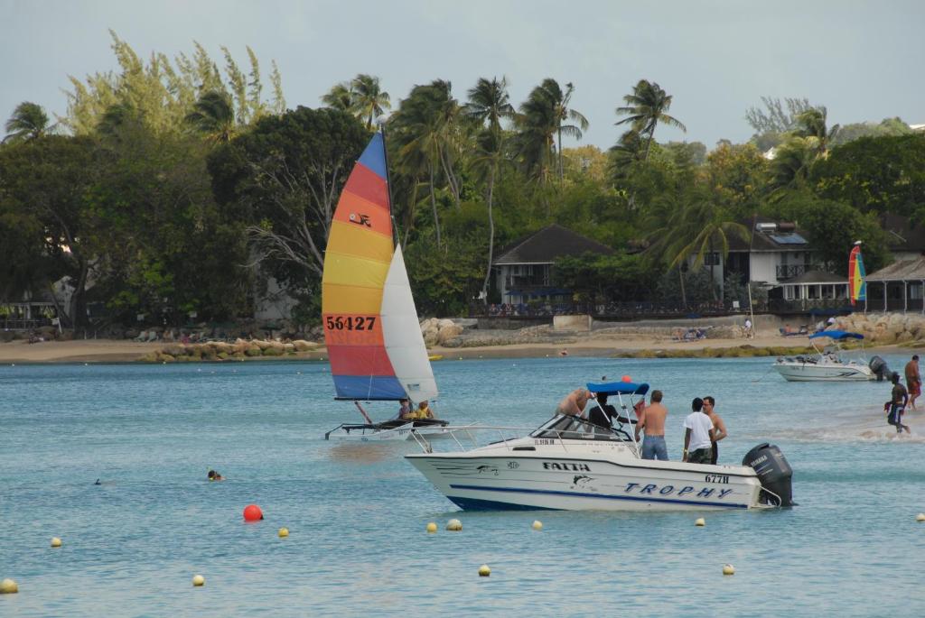 a group of people on a boat in the water at Sandy Bliss Condominiums in Saint James