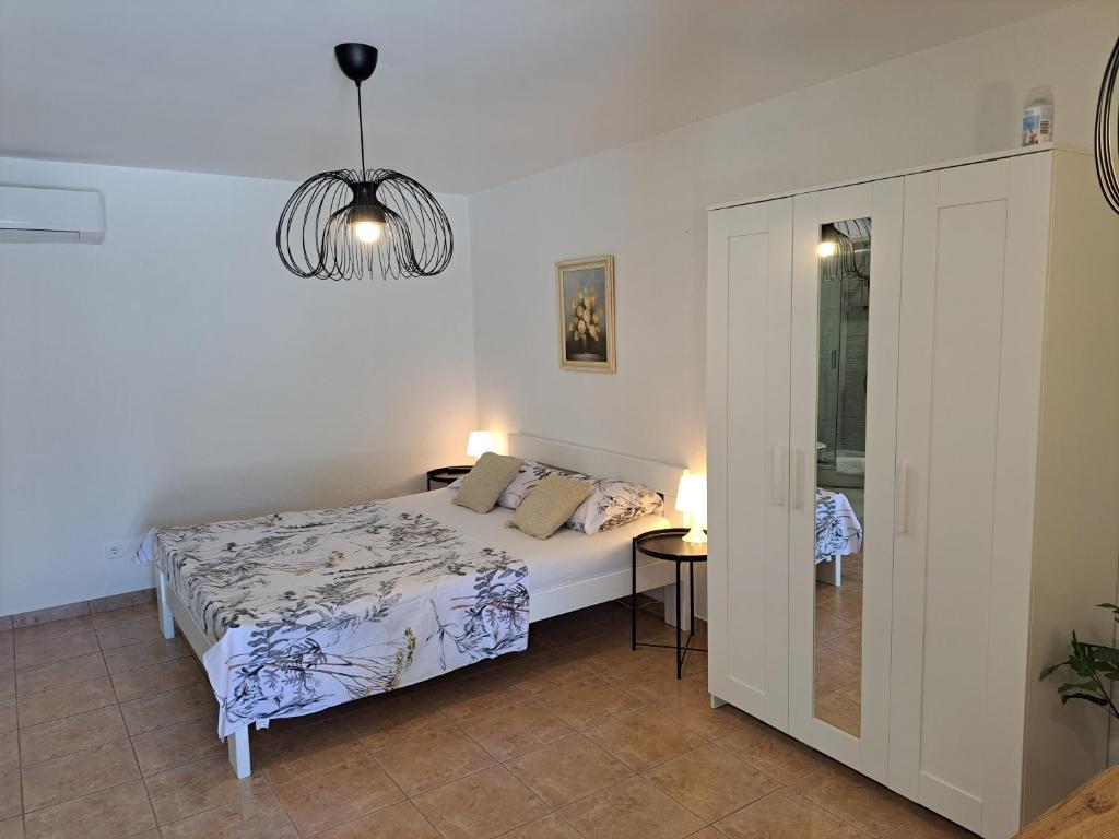 Postel nebo postele na pokoji v ubytování Apartments Dandić
