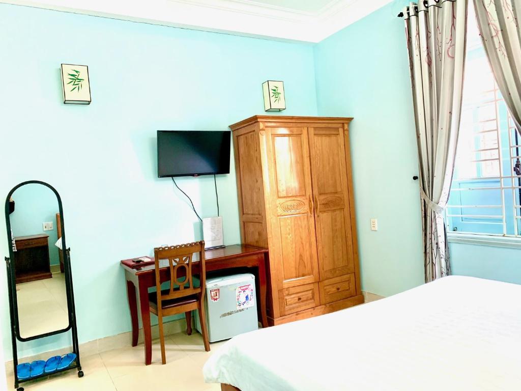 Postel nebo postele na pokoji v ubytování Areca Homestay