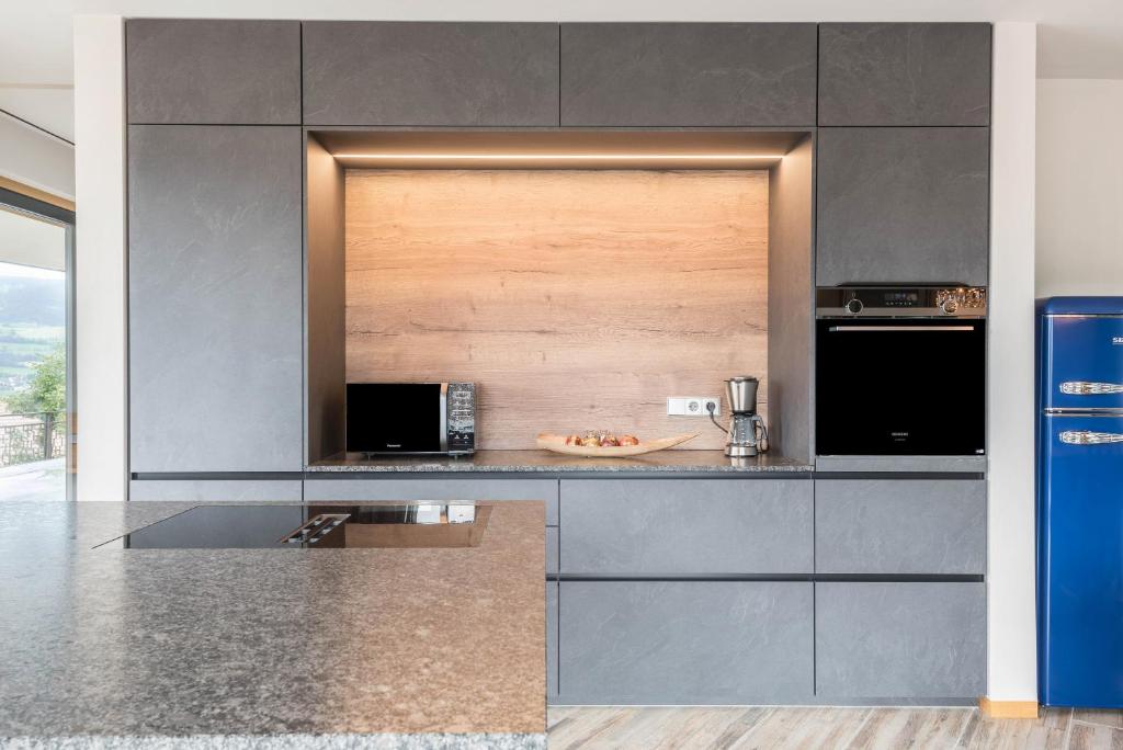 Kuchyň nebo kuchyňský kout v ubytování Aumia Apartment Saphir