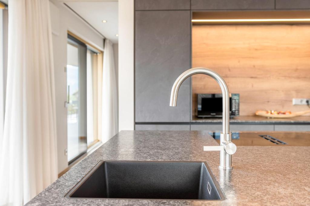 Kuchyň nebo kuchyňský kout v ubytování Aumia Apartment Saphir
