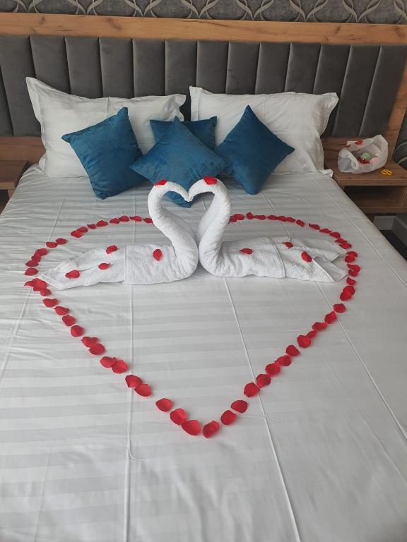 Postel nebo postele na pokoji v ubytování Hotel Excellence