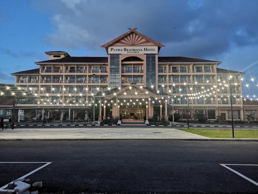 a large building with lights in front of it at Putra Brasmana Hotel in Kuala Perlis