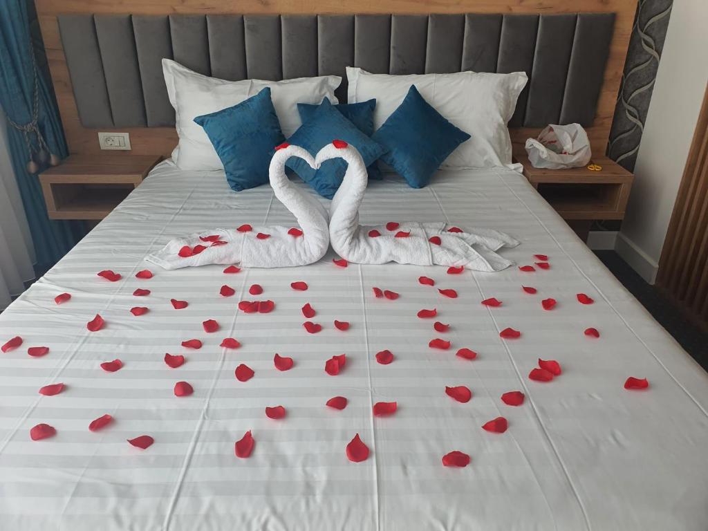 Postel nebo postele na pokoji v ubytování Hotel Excellence