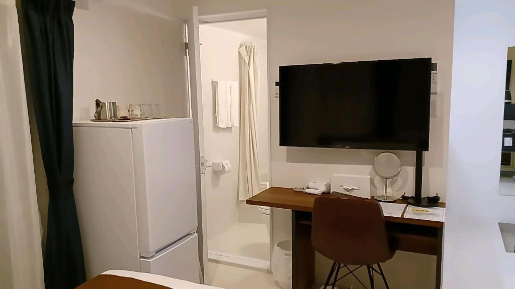Kuchyň nebo kuchyňský kout v ubytování Living Inn Nahakoumae
