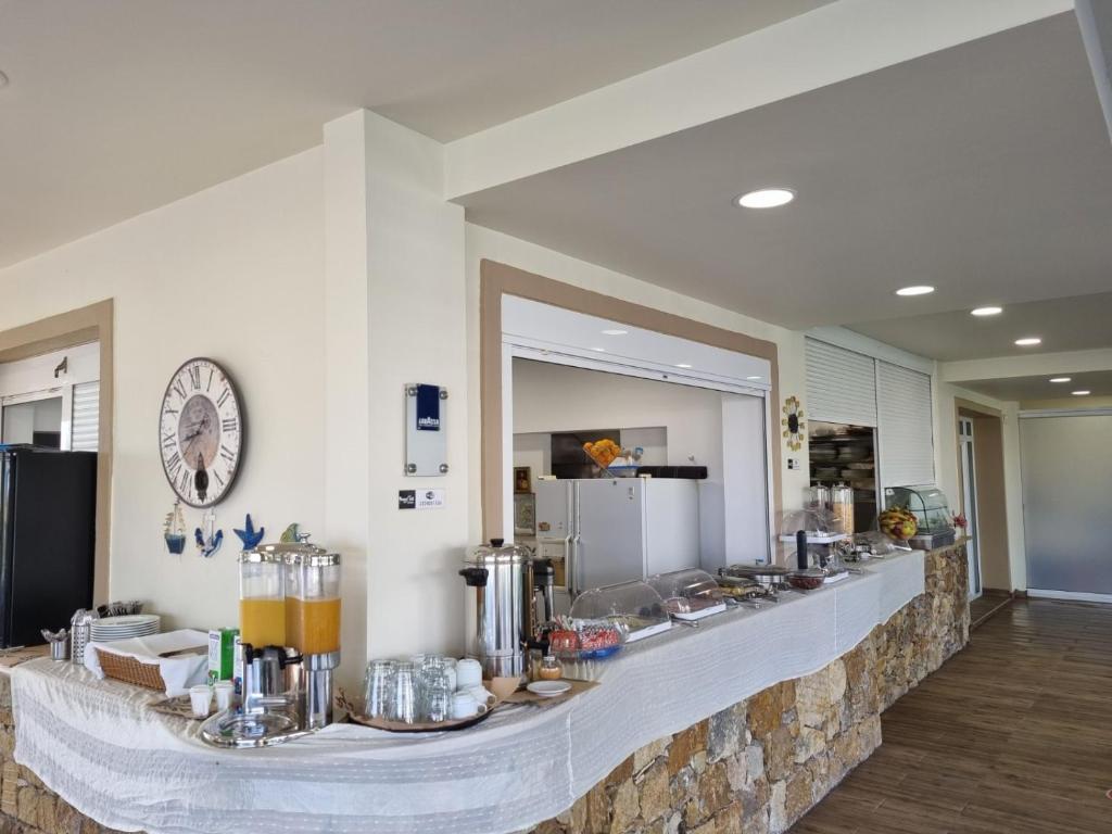 a long counter in a room with food on it at Sunny Hill in Sani Beach