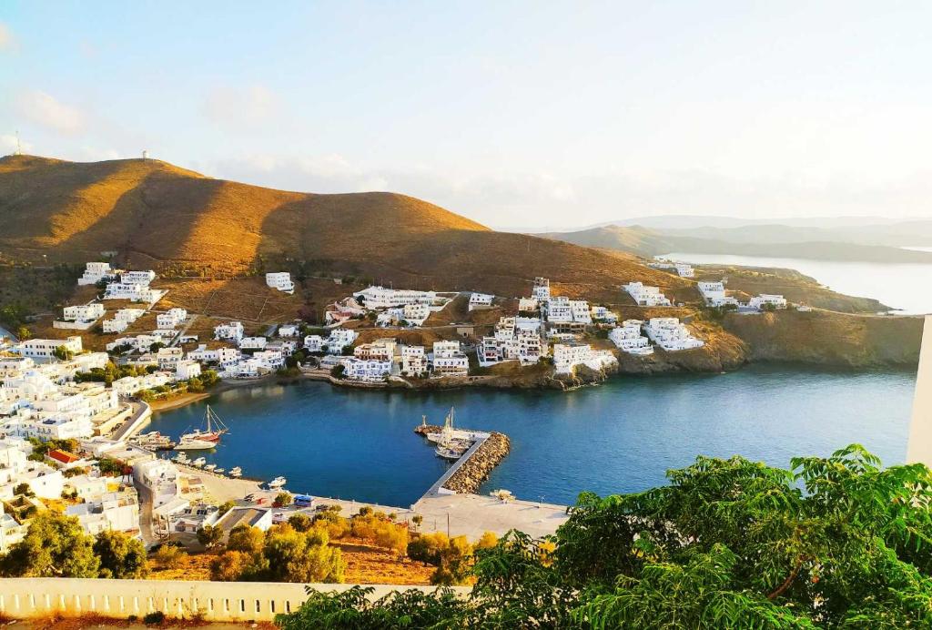 an aerial view of a small harbor on a hill at Balcony to Aegean sea in Astypalaia Town