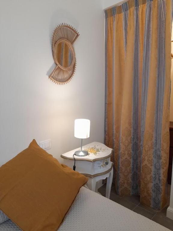 Łóżko lub łóżka w pokoju w obiekcie B&B Villino Luschi Pisa Centro