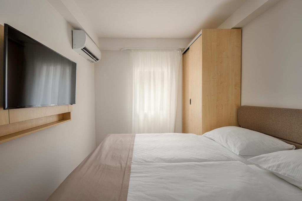 Postel nebo postele na pokoji v ubytování Hotel Delfin
